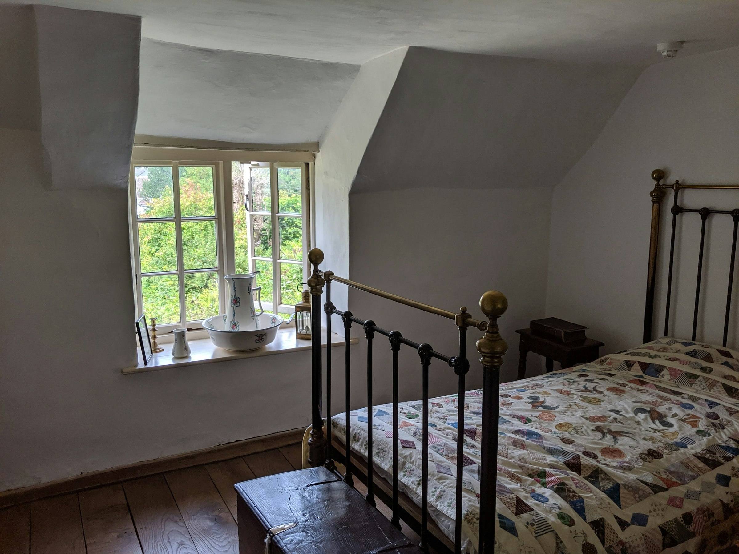 A quiet bedroom with soft morning light from the window
